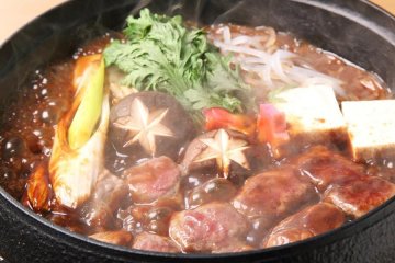 Horse sukiyaki, prepared and served by the restaurant staff at your table