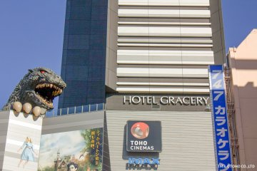 Godzilla peers over the lobby floor of the hotel