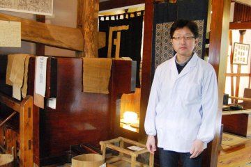 The brew master welcomes guests on a tour through the sake brewery
