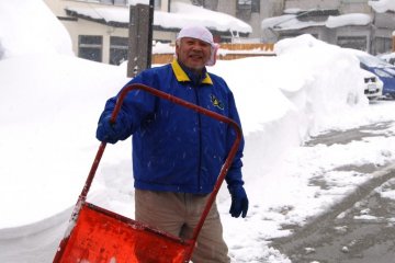 The locals try their best to remove the snow from streets, passageways and car parks