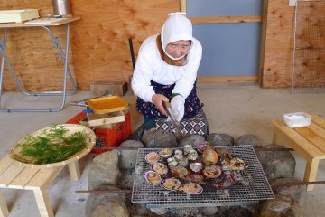 Lunch is served by women in traditonal divers' outfits