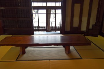 A solid table at the back of the store house