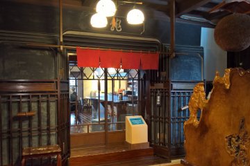A coffee shop inside another store house at the back