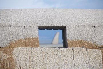 The pretty beach is dotted with concrete art works.
