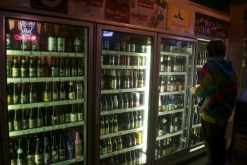 A customer browses the selection of bottles.