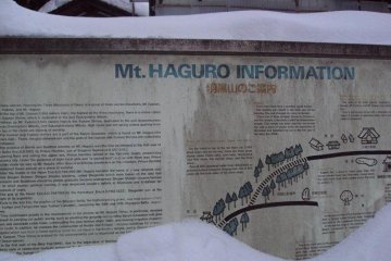 A welcome sign is nearly drowned in the snowfall.