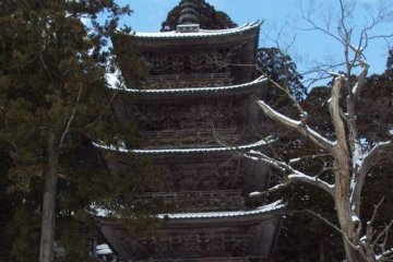 Matching five story pagodas decorate Dewa Sanzan. One marks the footpath to a mile of 2,446 stairs to the top of Mt. Haguro.
