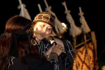 Playing the Mukkuri, which is a traditional jaw harp usually made of bamboo