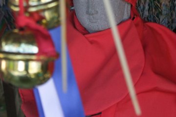 Close up on one of the jizo statues