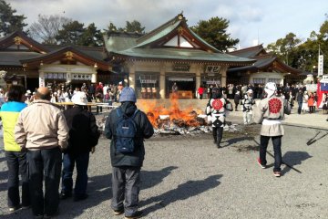 Fire Masters in cool garb keep the fire stoked