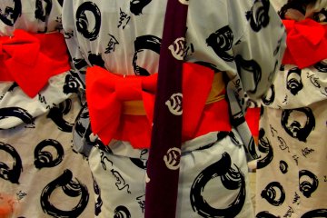 Yukata fabric is patterned with the Dogo Onsen logo