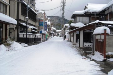 The main street of Yutagawa Onsen in winter