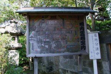 A map of the temple painted on a wood board sign