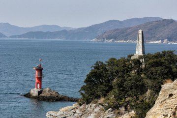 The lighthouse and momument at the end of Cape Suwazaki in Yawatahama. The signs say, "Don't climb over the railing". You should follow that adivce.