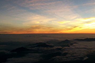 The rising sun above the clouds