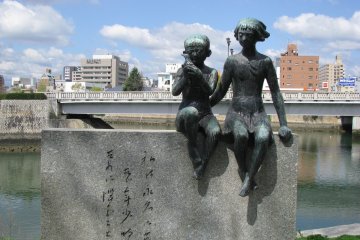 Sculpture of children with a dove of peace
