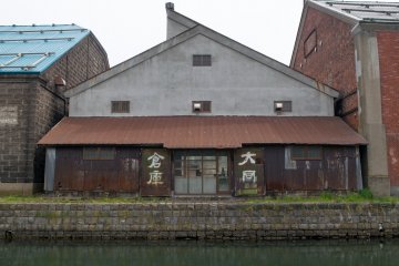 Old warehouses line Otaru canal