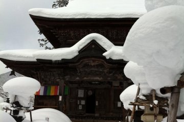 After the drunk, limb-locked men have cleansed themselves with freezing water from the temple's fountains, have thrown open the temple doors, they scramble up the rope to reach the gong at the top of the rafters for New Years good luck.