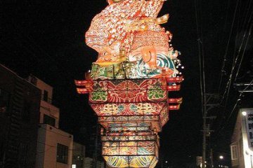 Often the buildings along the parade route are dwarfed by floats of deities and demons pulled by armies of human volunteers.