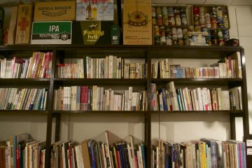 A wall of books that has since been replaced with a door to a newly added second room.