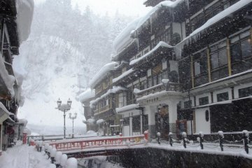Snow piles up high in winter at Ginzan Onsen