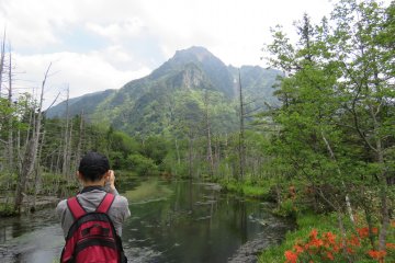 Taking pictures of Mt Myojin-dake and pond