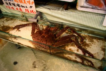 A live crab in one of the many seafood vendors along Sakaimachi Street.