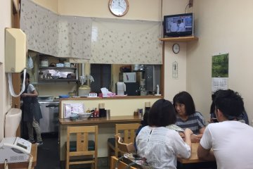 Simple decor, with tables and counter seats