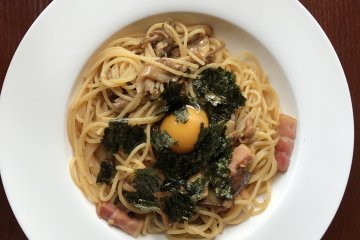Japanese pasta with egg yolk, bacon, seaweed and mushroom