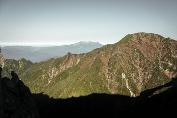  While continuing my hike, I could see Mount Ontake gradually revealing itself more clearly