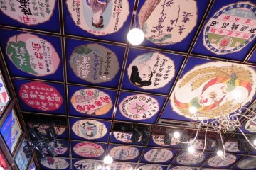 Ceiling panels painted with early 20th century advertisements