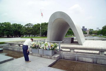 A visitor paying respects to the deceased