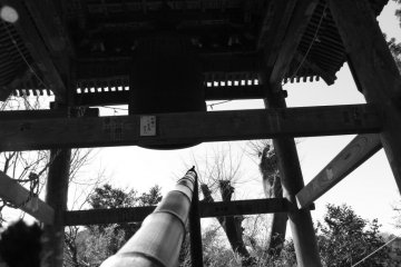 The temple's main bell, with bamboo striker