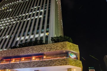 Looking up at the Sunshine Tower from the ground level