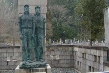 <p>Another company grave for past employees, as the snow begins to fall</p>