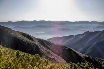  The early morning sun illuminated the deep valleys and endless ridge line 