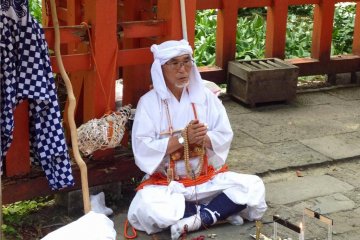 You may meet some white-clad pilgrims praying at the shrines on Haguro-san.