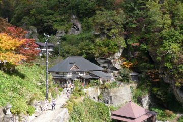 Autumn foliage, caves, paths and buildings of Yamadera Temple