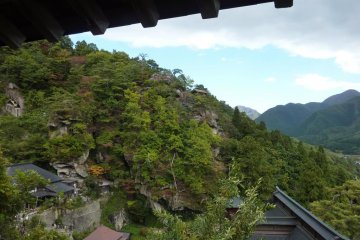 Photograph over the side of Yamadera Temple with a remote building visible