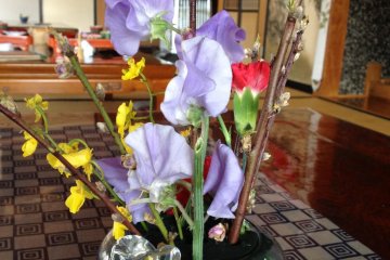 <p>Spring flowers add a splash of colour to the table.</p>