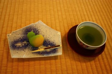 A traditional Japanese sweet and cup of green tea.