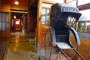 A Meiji-era rickshaw is one of the interesting objects on display.