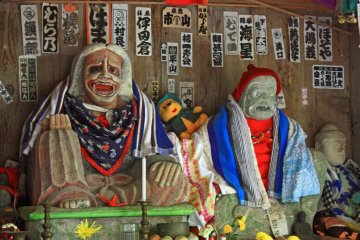 These statues, in a small shrine on the way up to the top, are surely enough to give young children nightmares!