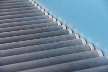 <p>The slide consists of hundreds and hundreds of rubber covered metal rollers</p>