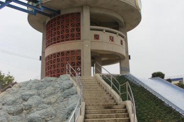 <p>The slide begins from the thrid story of an observation tower that is elevated about five meters above the level of the rest of Manta Park</p>