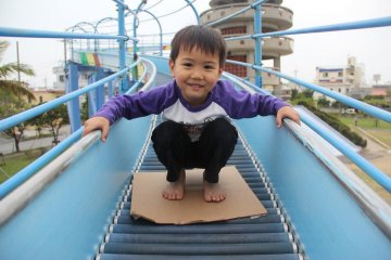 <p>Try crouching on a piece of cardboard to build up speed</p>