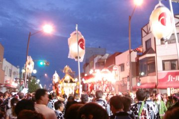Dusk approaches and festival lights burn