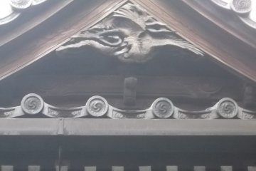 A carving under the eaves of the hall