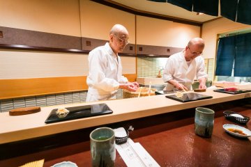 Jiro and his son Yoshikazu preparing sushi