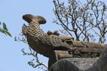 Upon closer inspection the top of the stone gate is not a torrii but is decorated with fish carved into stone